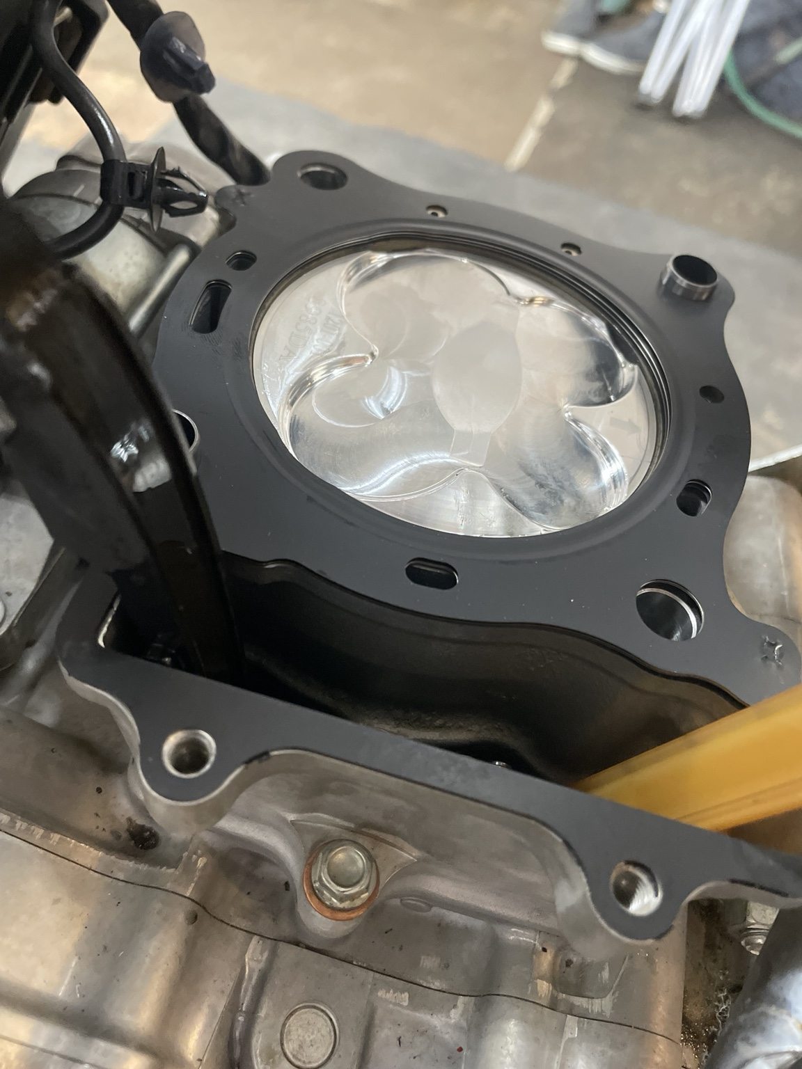 Piston and gasket during top end rebuild